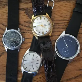 Vintage beauties from Oris, Omega, and Helbros, and an aventurine, jump-hour Sugess