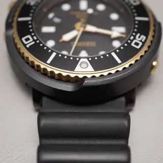 Seiko Prospex SBDN028 V147 Lowercase Limited Black Gold Tuna Solar Quartz Watch - $195