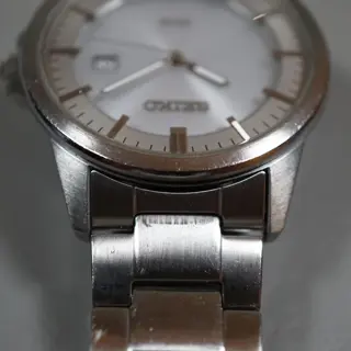 Seiko V147-0AF0 Silver Dial Solar Quartz Watch - $80