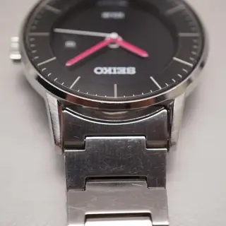 Seiko Spirit V147-0AK0 Black Dial Pink Hands Sector Dial Solar Quartz Watch - $100