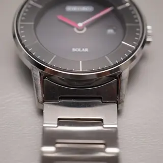 Seiko Spirit V147-0AK0 Black Dial Pink Hands Sector Dial Solar Quartz Watch - $100