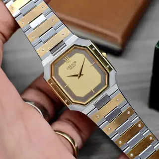 Credor twotone 14kt bezel intergarted bracelet price 400$