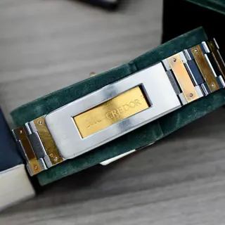 Credor twotone 14kt bezel intergarted bracelet price 400$