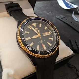 Orient Kamasu black and gold, with strapco oysterflex strap
