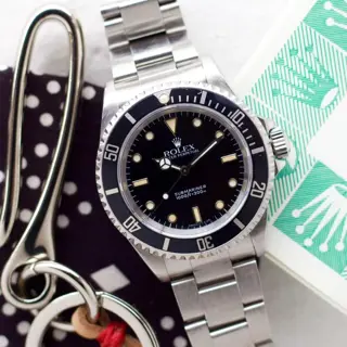 Rolex Submariner ref. 14060 E-Serial 1990 with Papers