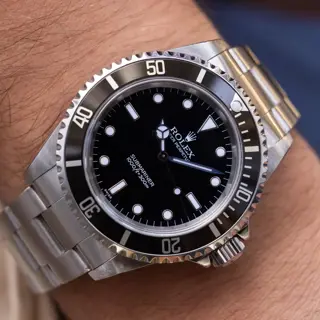 1999 Rolex Submariner Ref. 14060 | Swiss Only Dial | Box and Papers