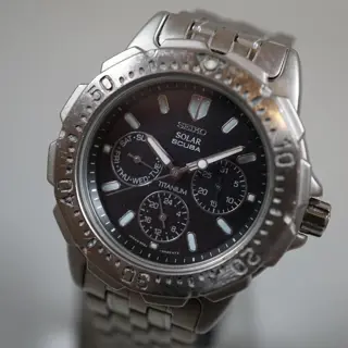 Seiko 5K2J-0A30 Black Dial Scuba 200M Day Date Solar Quartz Watch - $135