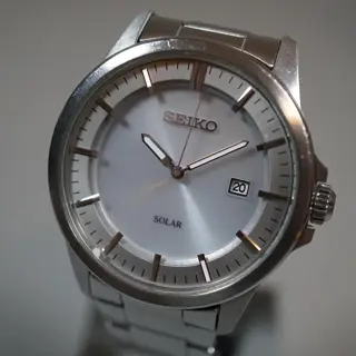 Seiko V147-0AF0 Silver Dial Solar Quartz Watch - $80