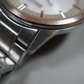Seiko V147-0AF0 Silver Dial Solar Quartz Watch - $80