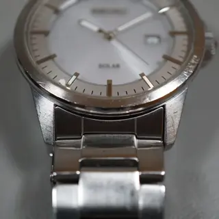 Seiko V147-0AF0 Silver Dial Solar Quartz Watch - $80